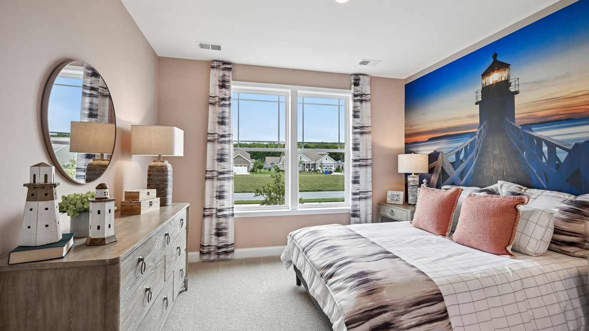 The secondary bedroom has a large window to bring in lot of light.