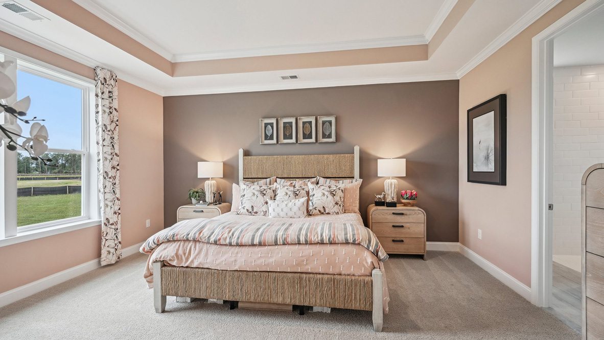 The primary bedroom has a beautiful tray ceiling.