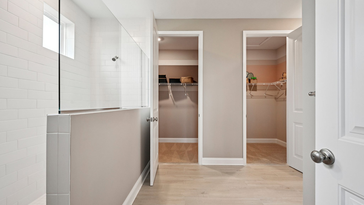 The primary bathroom has a large walk-in shower.