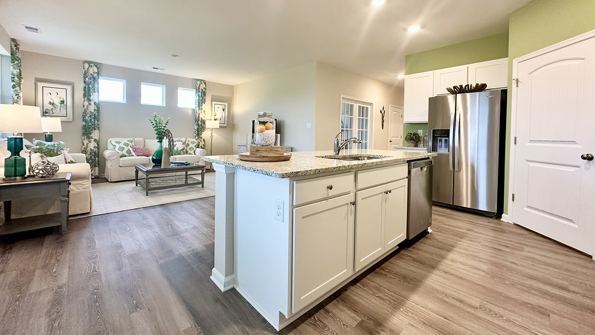The kitchen is open to the ample living and dining rooms.