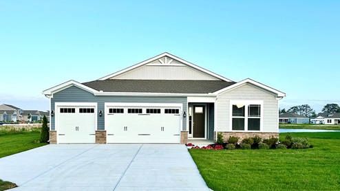 Woodfield Preserve Destin home with a three-car garage.