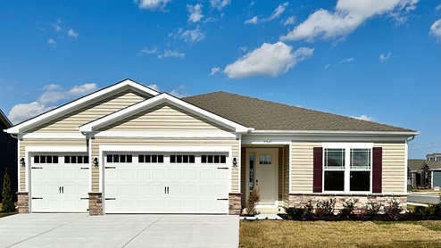 Woodfield Preserve Wheaton home with tan siding.