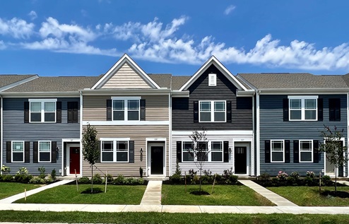 Sassafras Meadows exterior photo of four styles of townhomes.