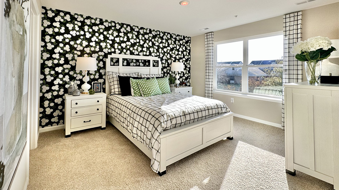 The upstairs owner's bedroom with an en suite bathroom and a walk-in closet sits in the back of the home for privacy.