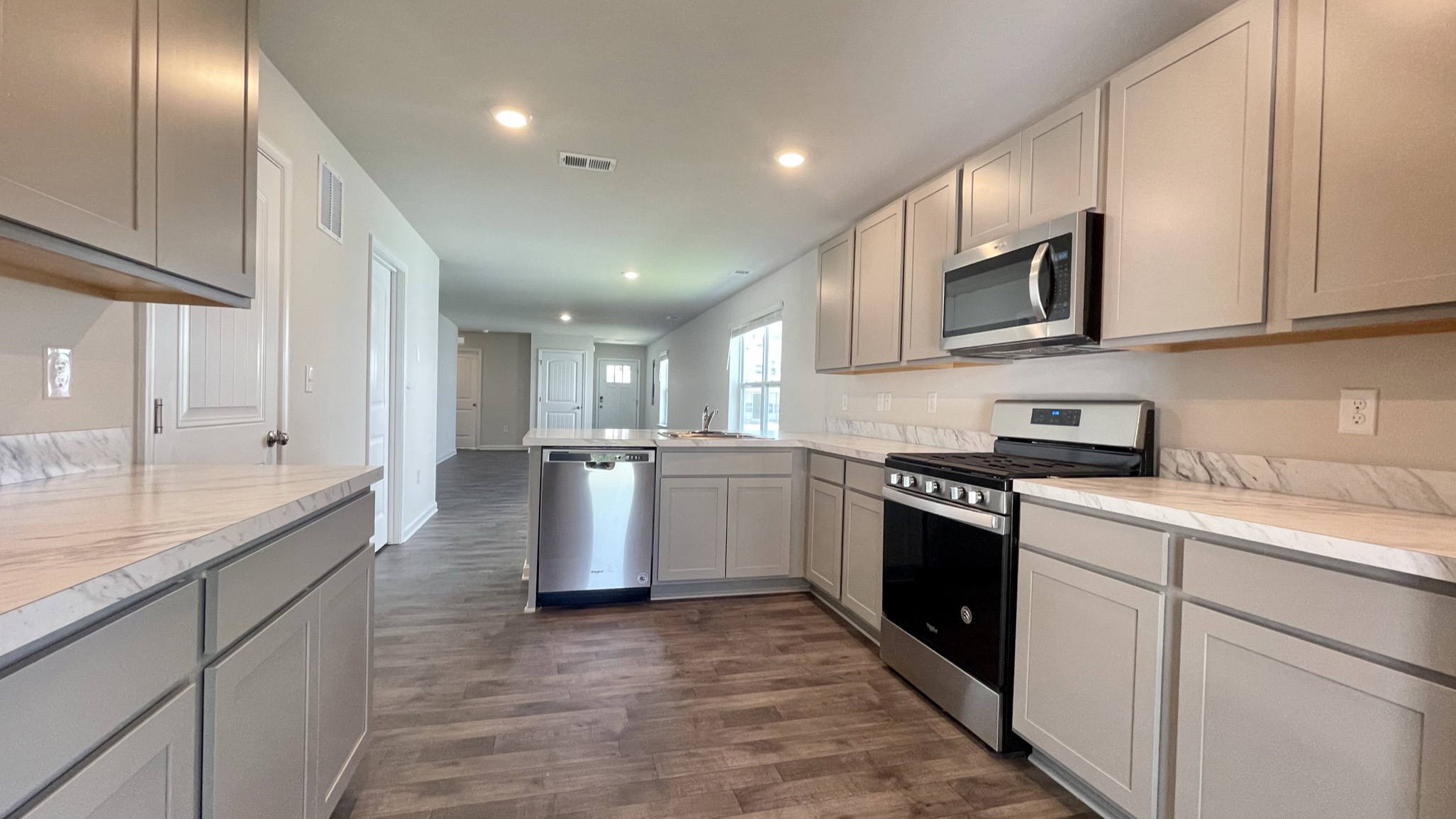 The well-appointed kitchen features stainless steel appliances.