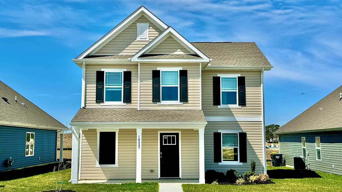 A Paige two-story home with yellow siding.