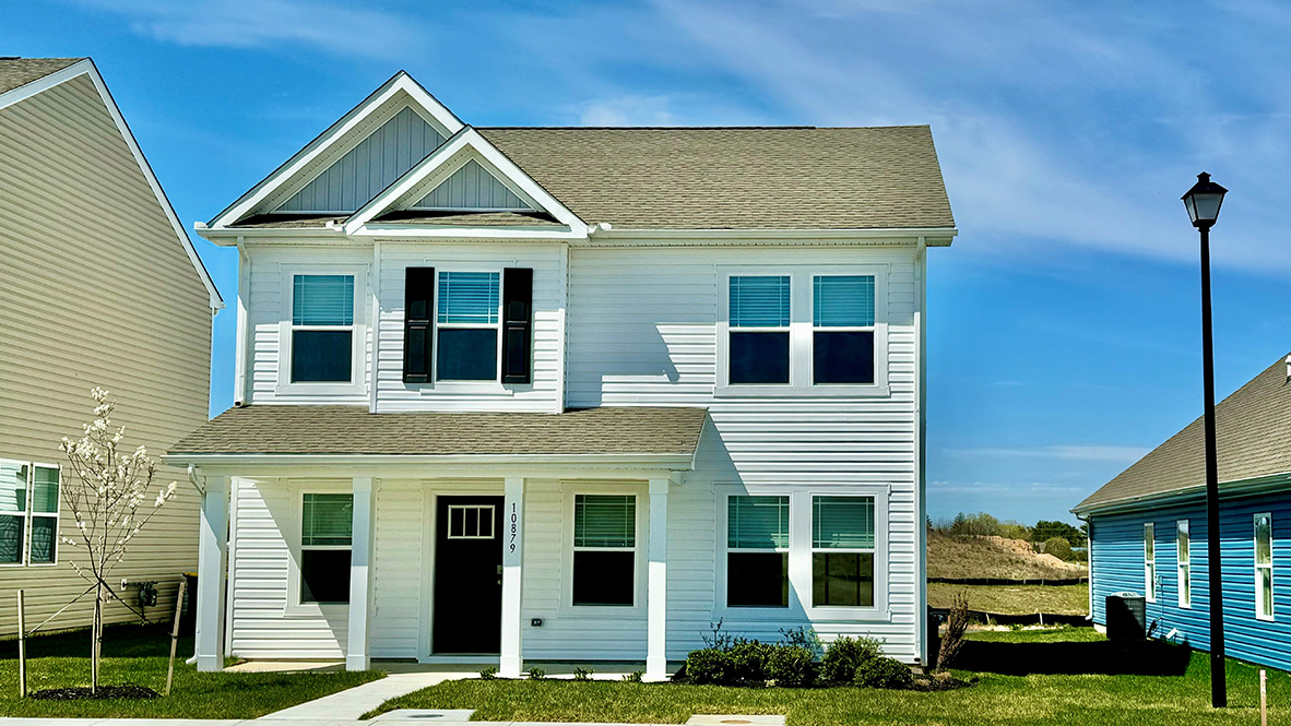 A Sidney two-story home with white siding.