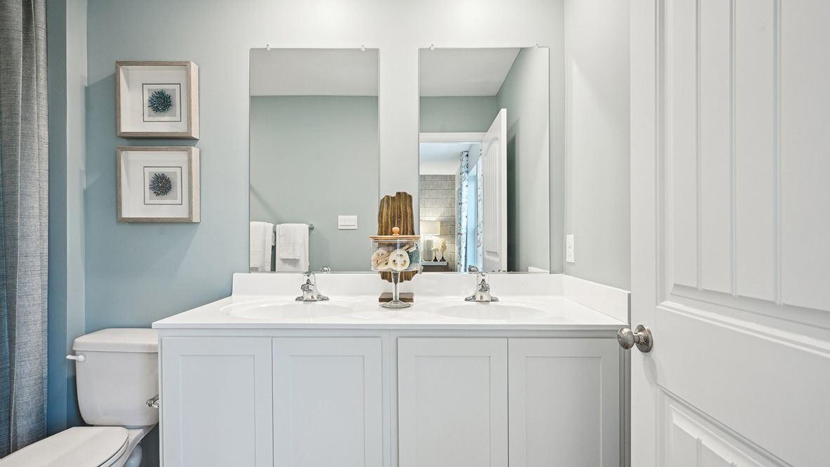 Primary bathroom with double bowl vanity.