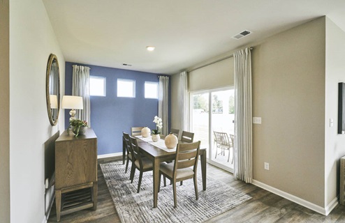 Dining room that leads to back patio door.