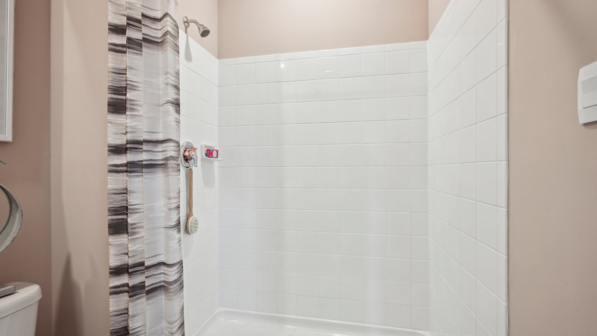 The walk-in shower in the bathroom.