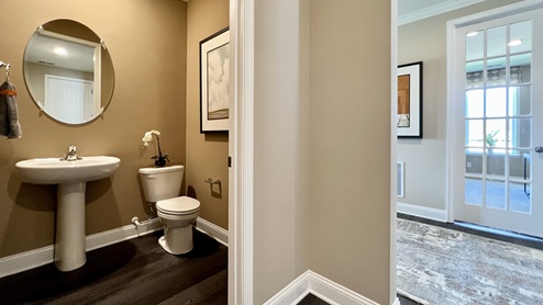 Continuing from the guest bedrooms is the hallway powder room.