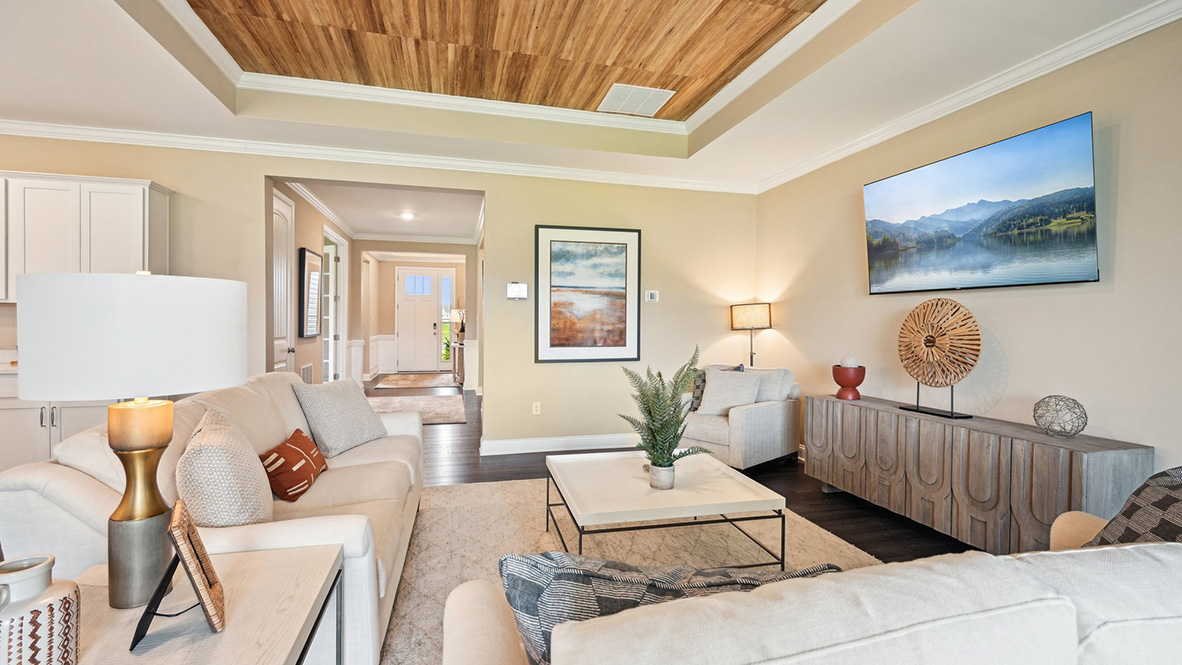 The open-concept great room has a tray ceiling.