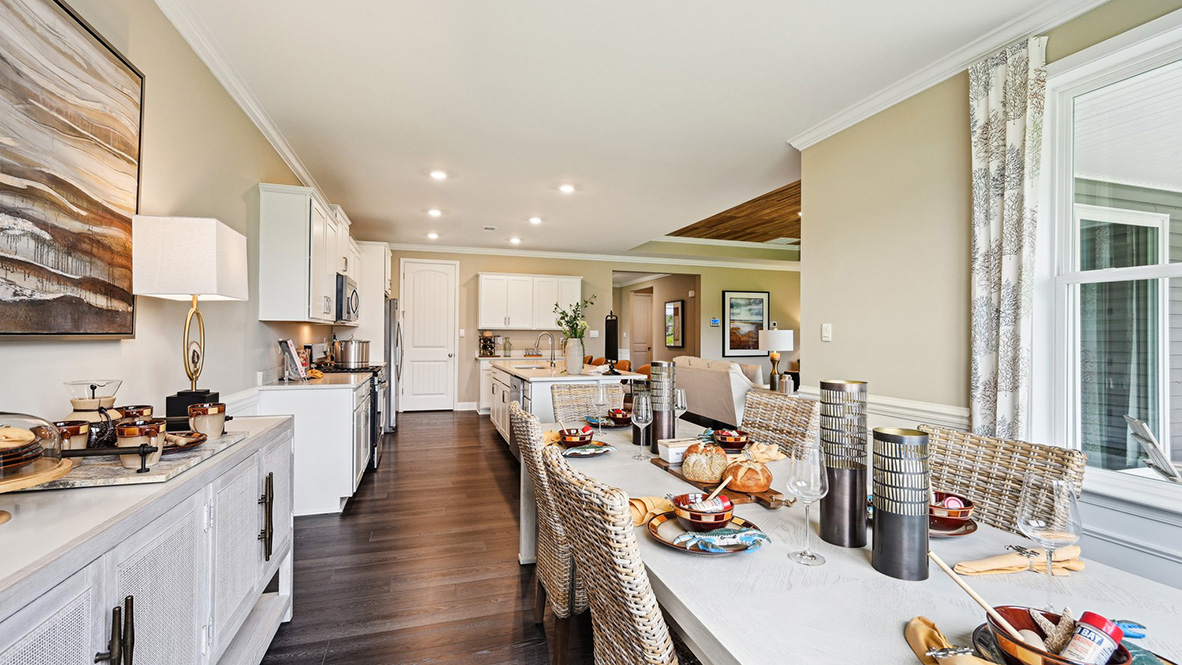 The kitchen overlooks the large dining room.