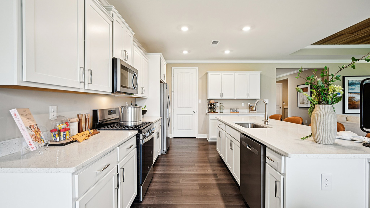 The kitchen is complete with classic cabinets.