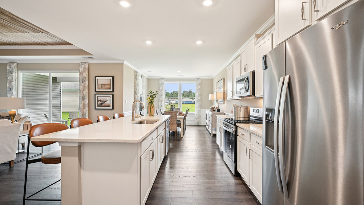 The kitchen overlooks the large dining room.