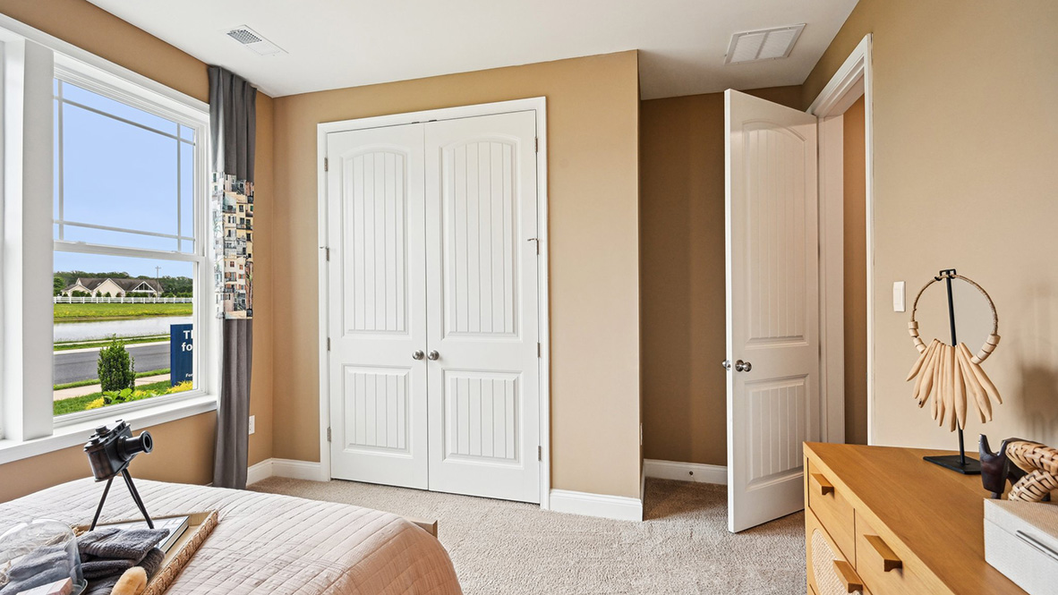 The first guest bedroom has a large closet.