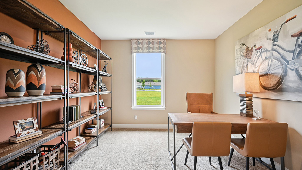 The inviting study is a versatile space with an abundance of natural light.