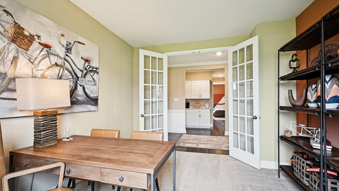 The study has beautiful French doors.