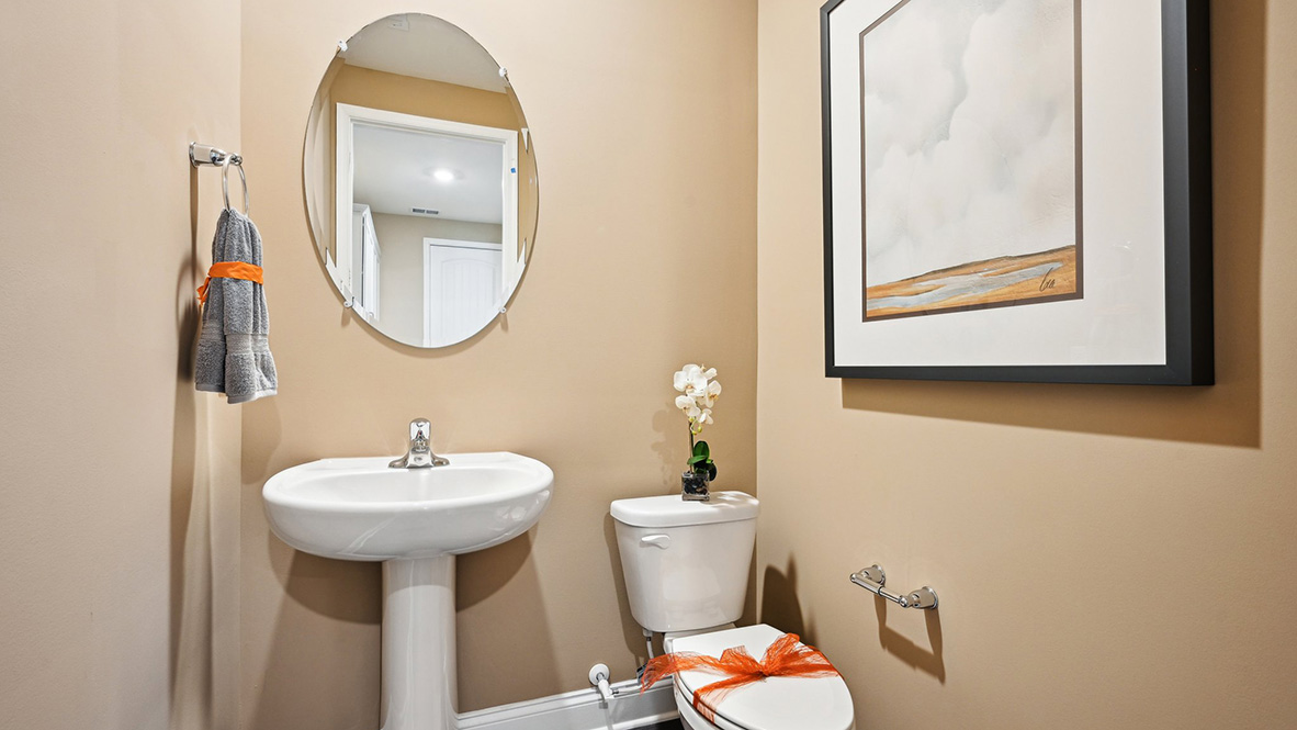 On the other side of the hallway is a powder room.