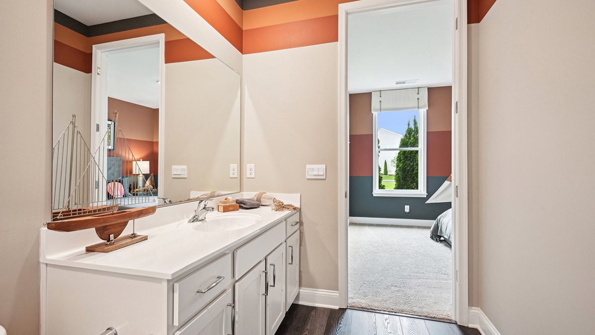 The second guest bathroom includes a vanity.