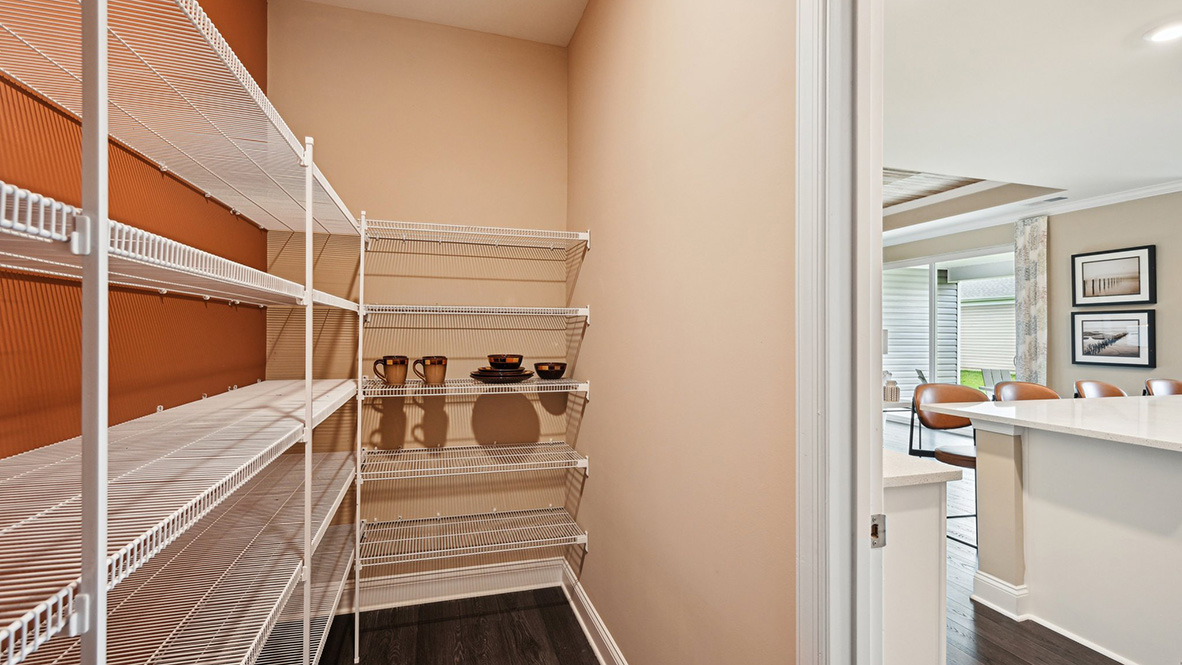 The corner walk-in pantry is expansive.