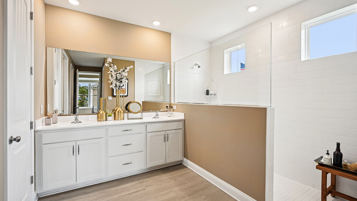 The primary bathroom has a double-bowl vanity, linen closet, and toilet closet.