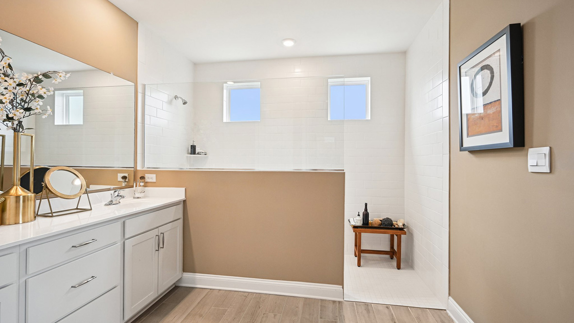 The primary bathroom has an expansive walk-in shower.
