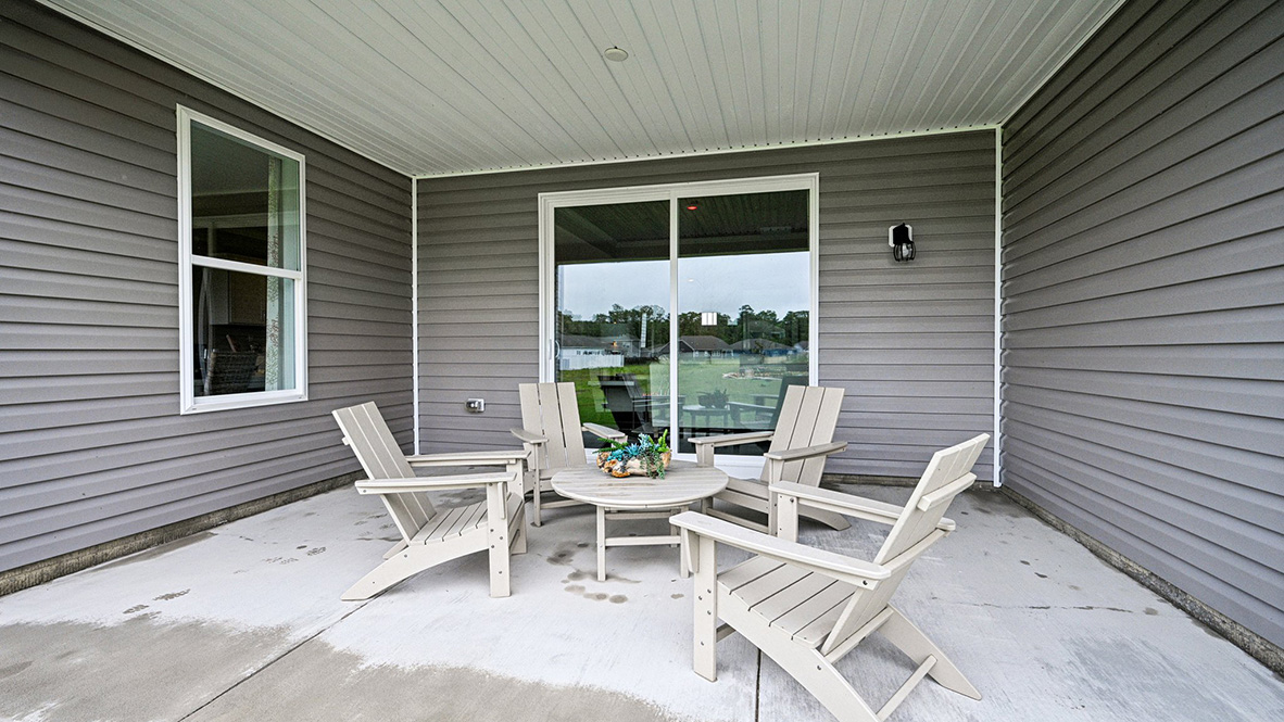 The open-concept great room leads you to the covered porch.
