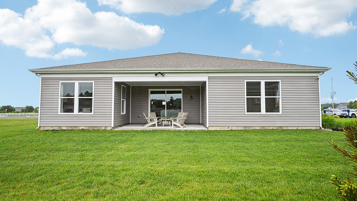Enjoy the private covered porch in the back of the home overlooking the fully sodded, irrigated, and landscaped yard.