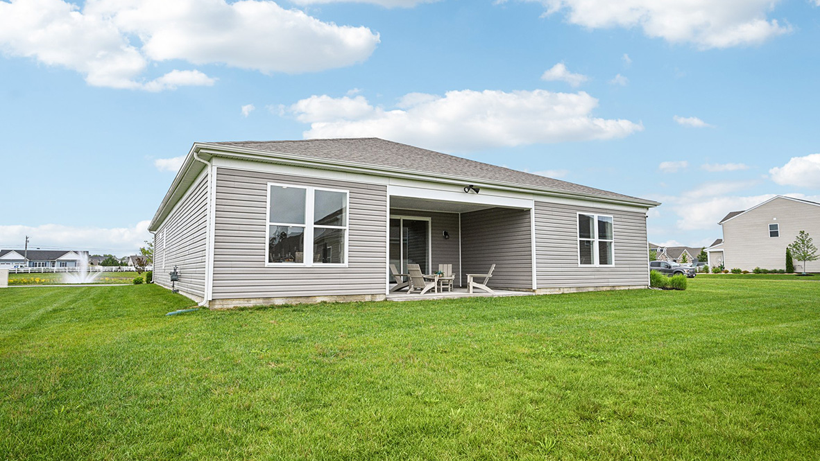 Enjoy the private covered porch in the back of the home overlooking the fully sodded, irrigated, and landscaped yard.
