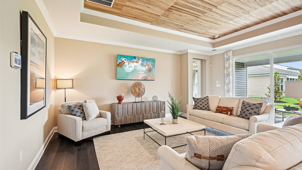 The door to the covered porch allows light to brighten the great room.