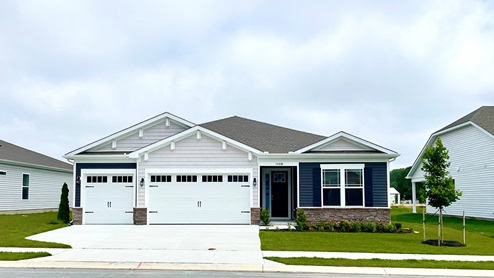 Ranch style Destin home with three car garage.