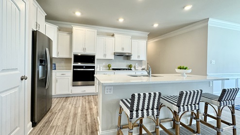 Kitchen with white kitchen cabinets.