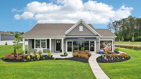 Plover Point Cali model home with blue siding and black shutters.