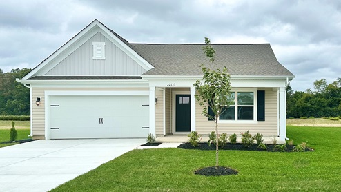 A Plover Point Cali home with yellow siding and a front porch.