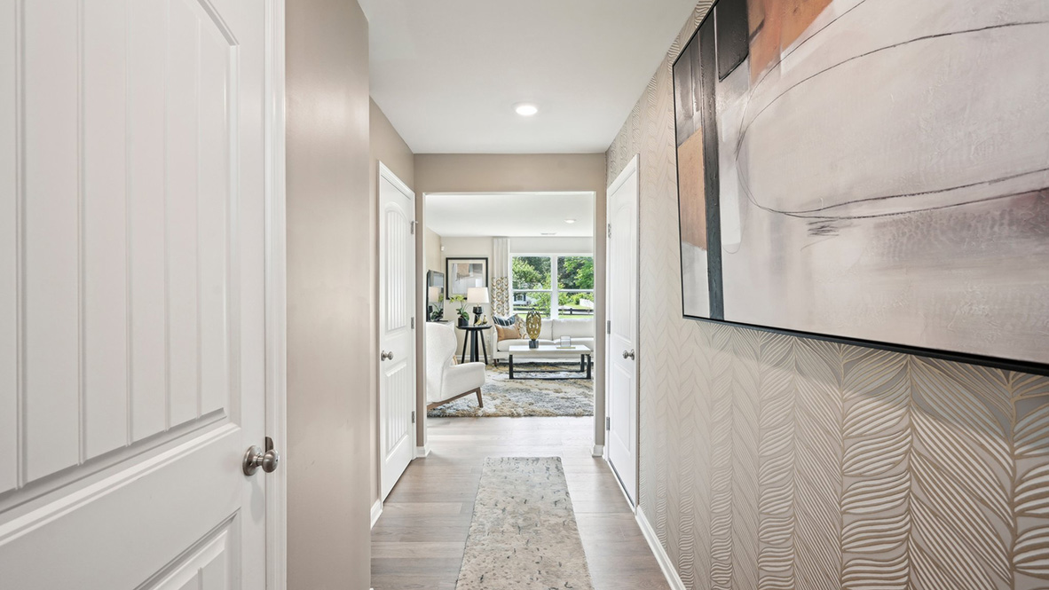 A foyer greets you as you enter this home from the porch.