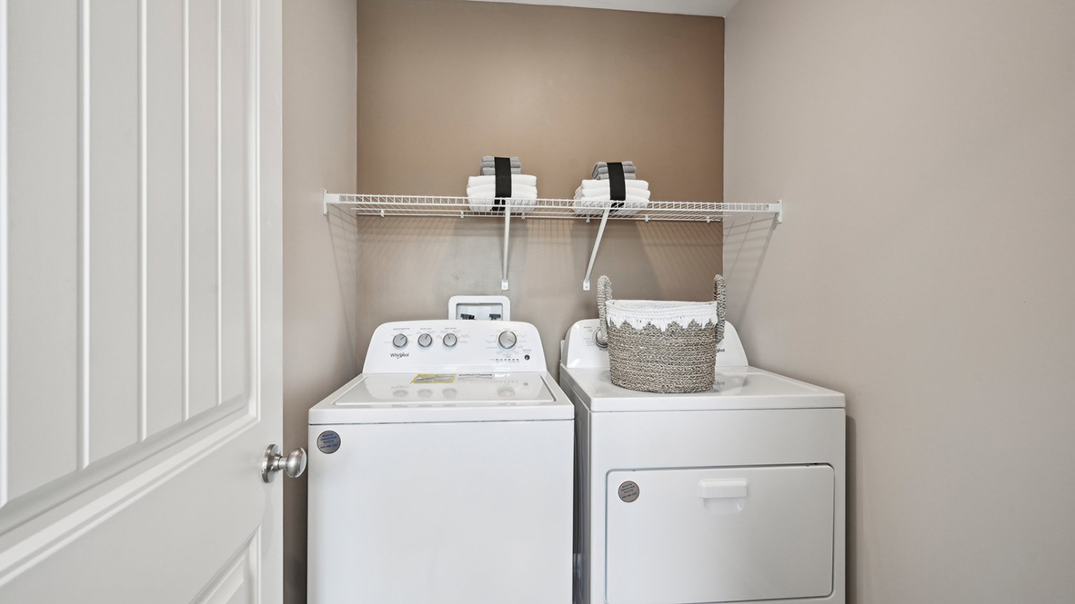 The laundry room is conveniently located upstairs.