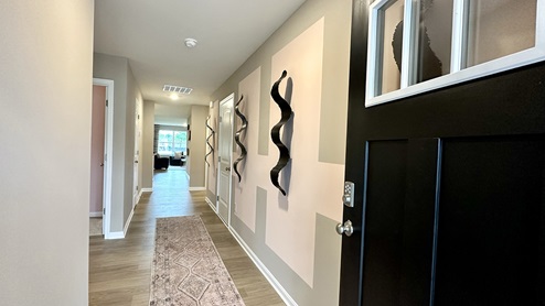 As you enter the home from your porch, there is a long hallway to enter the home.