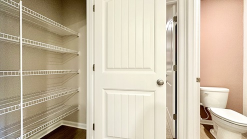 The primary bathroom has a large linen closet.