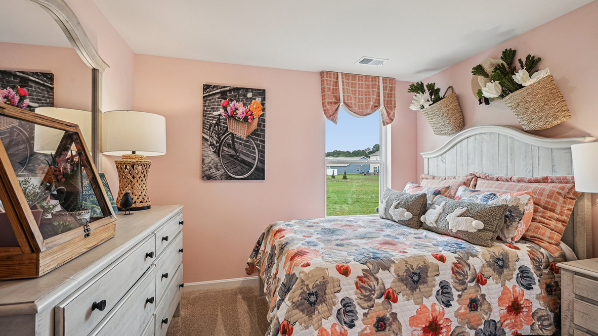 One guest bedroom has a window in the corner.