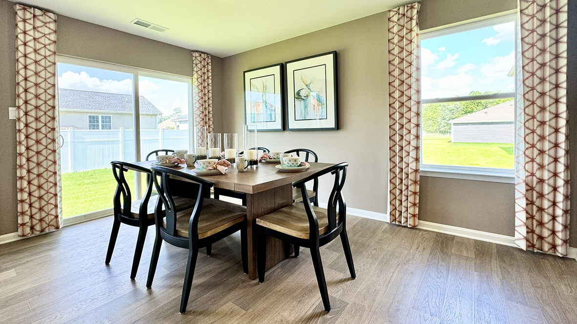 The open-concept kitchen overlooks dining area.