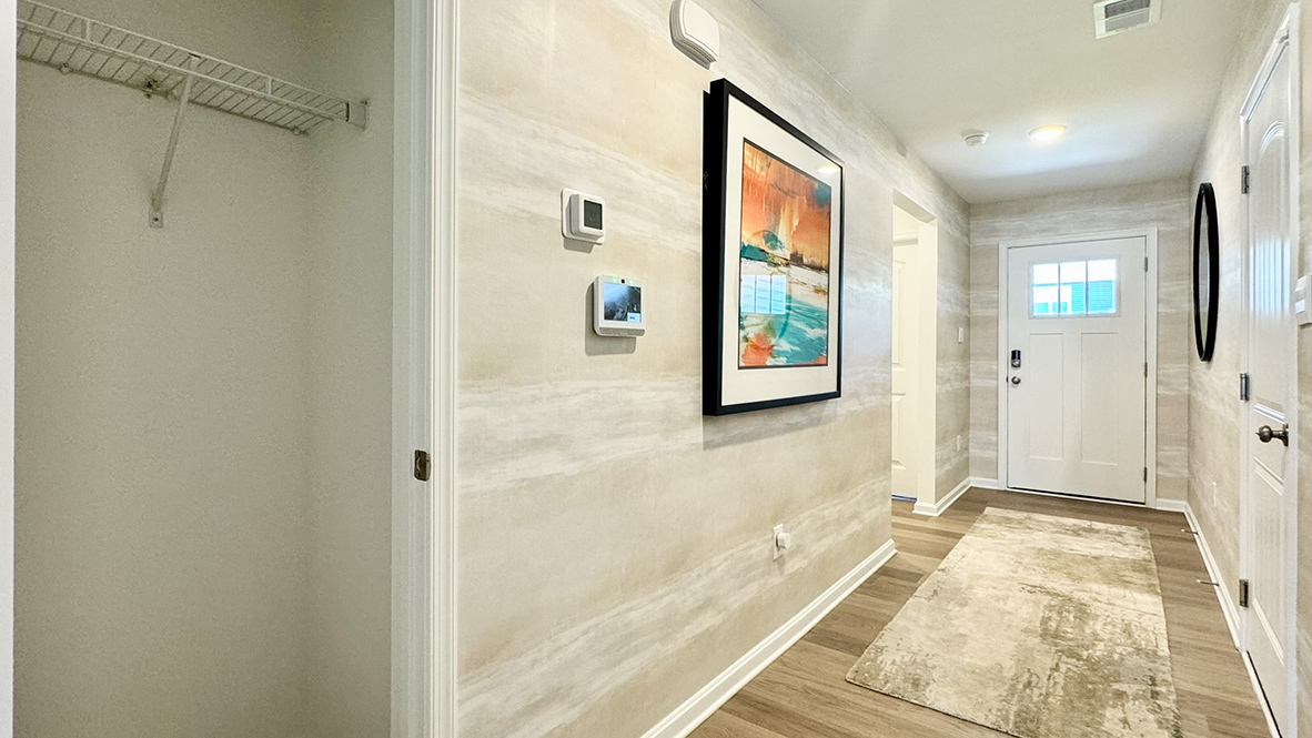 As you continue down the foyer, you will see a coat closet.