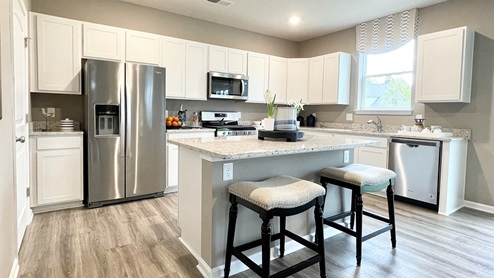 The spacious kitchen boasts a large island with room for seating.