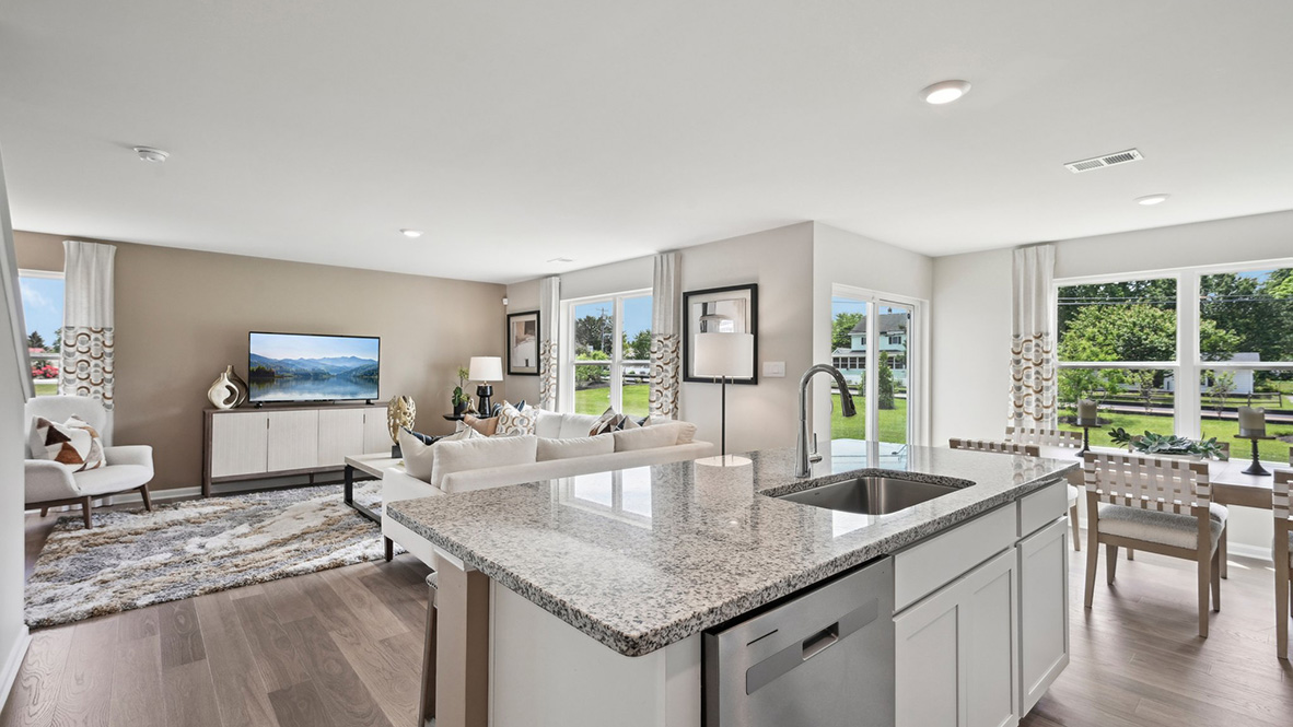 The spacious kitchen has plenty of modern cabinet space and granite countertops.