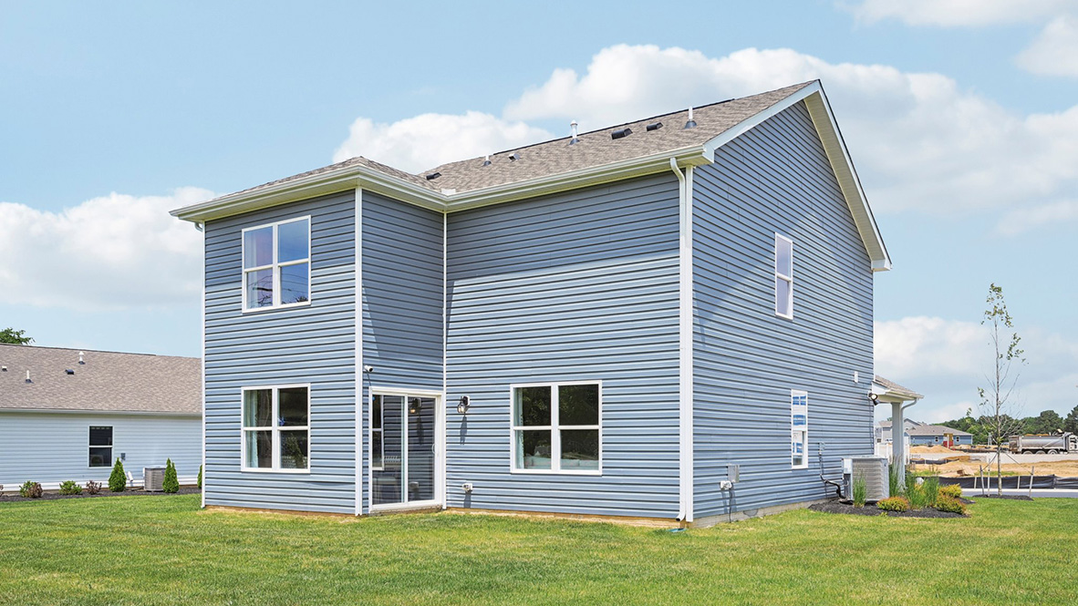 The sliding glass door leads to the backyard of the home.