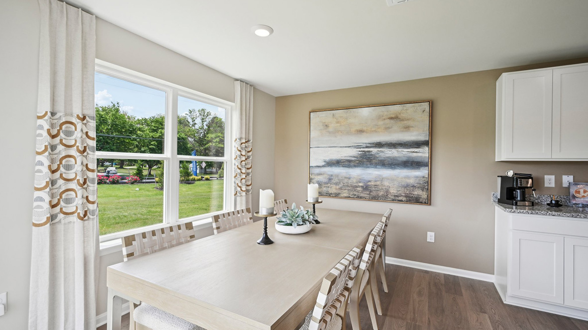 The kitchen has a designated dining area with a sliding glass door for easy access to the backyard.