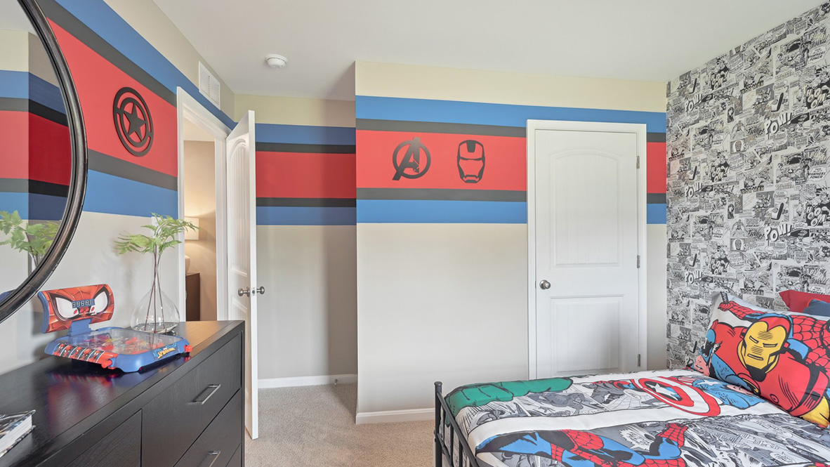 This guest bedroom has a corner closet.