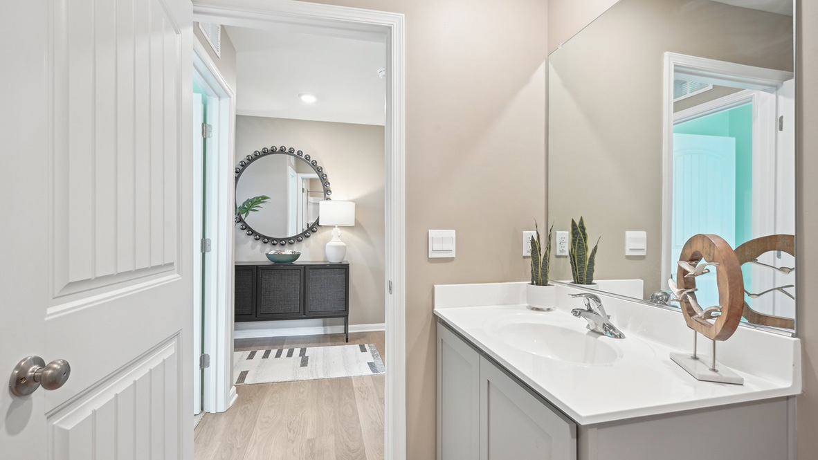 Two guest bedrooms share the same bath.