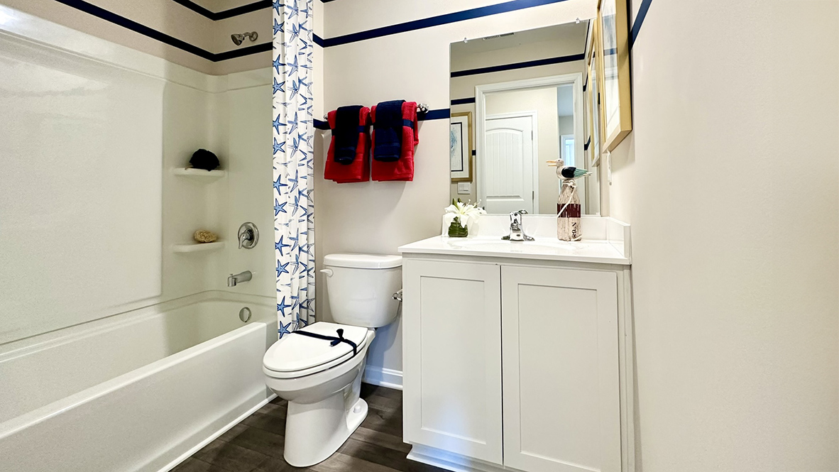A full bath is located across the hall from the three secondary bedrooms.
