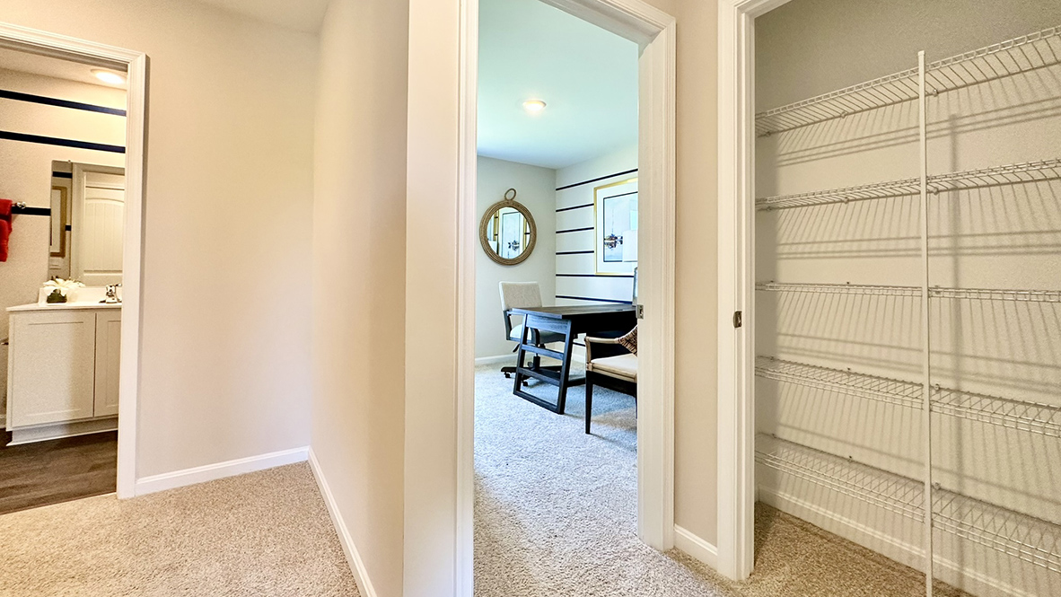 A large linen closet is in the hallway.